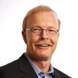 Smiling middle-aged man with glasses and mustache