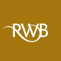 Stylized white RVWB logo on gold background