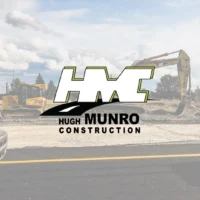 Hugh Munro Construction logo with excavator backdrop