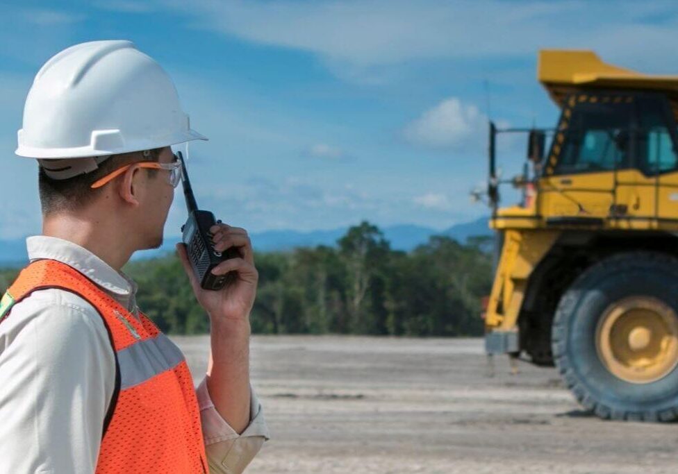 Construction worker using radio on site