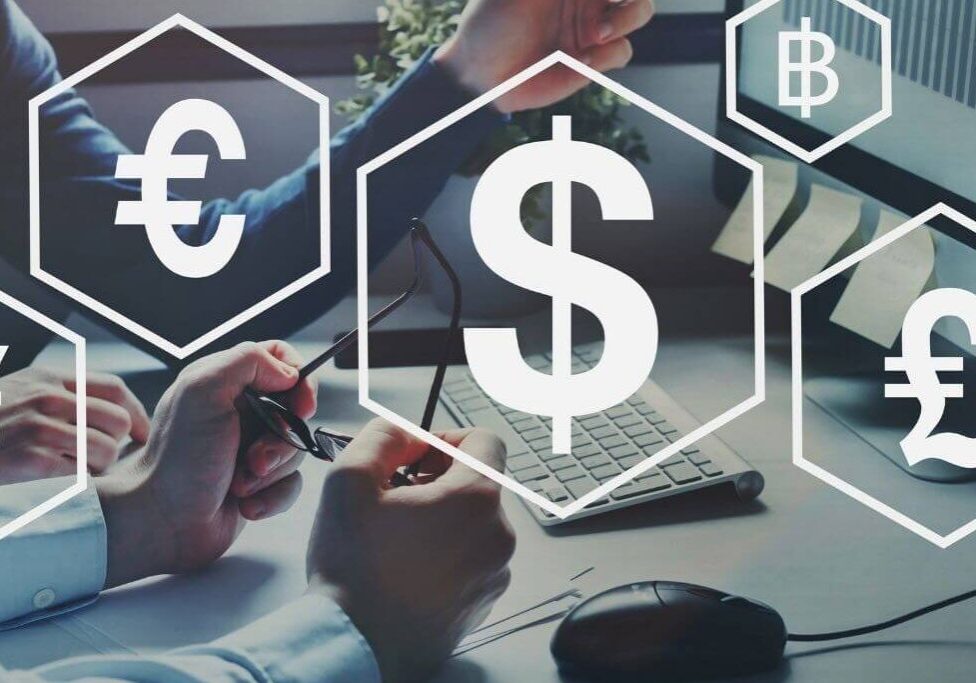 Currency symbols over people working at desks