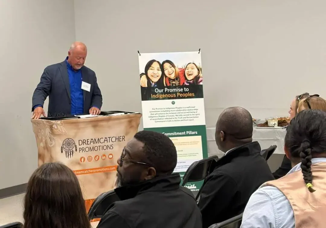 Man speaking at promotional event