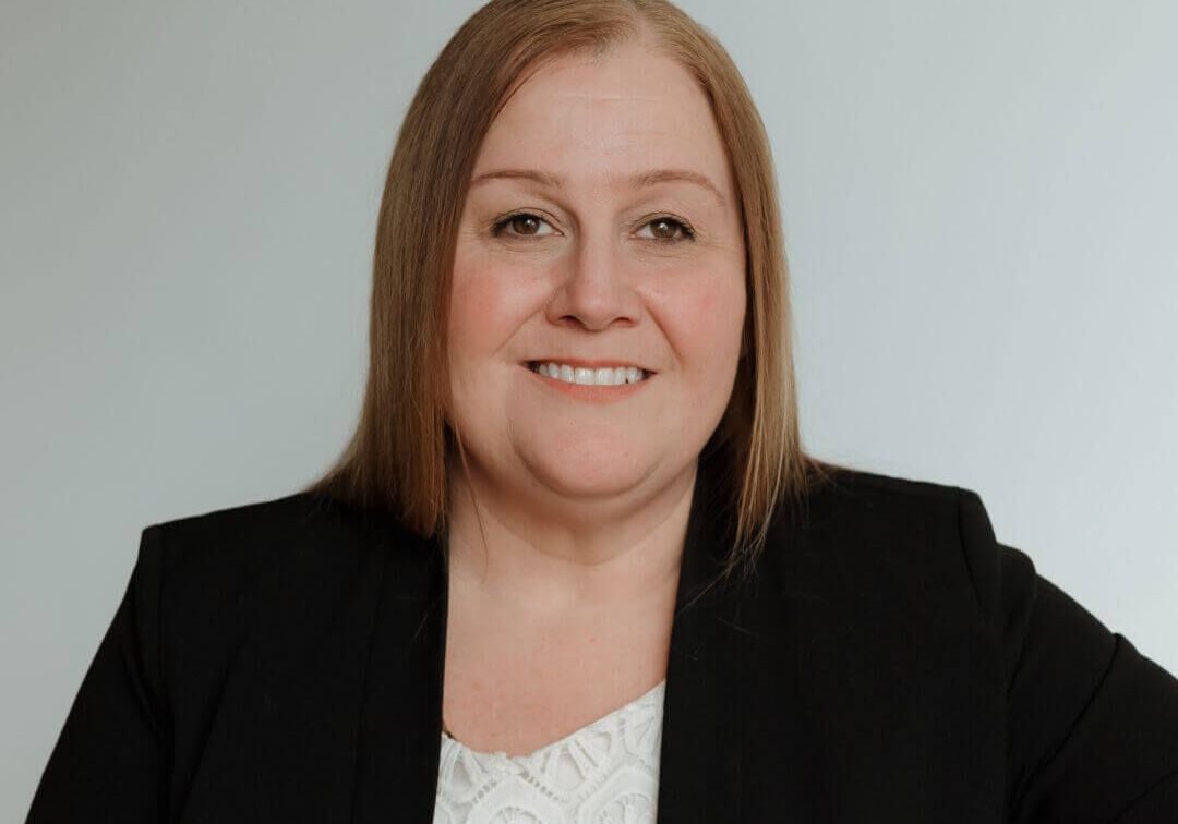 Professional woman posing in business attire