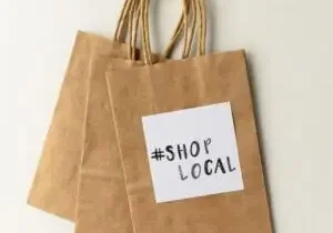 Eco-friendly shopping bags promoting local businesses
