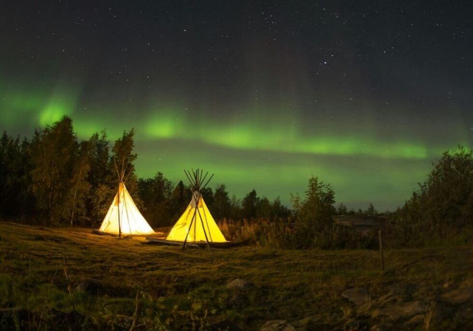 Night camping with aurora display