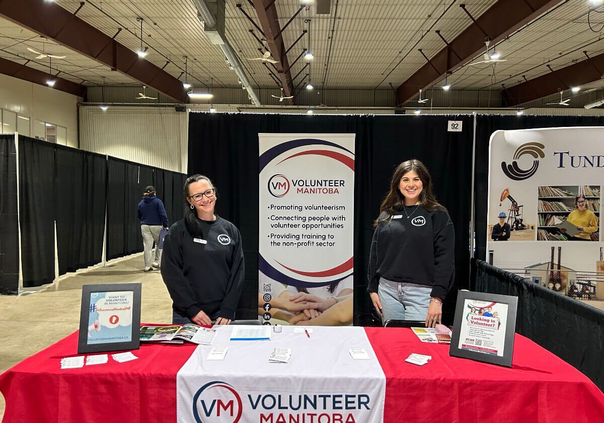Volunteer Manitoba booth with two representatives