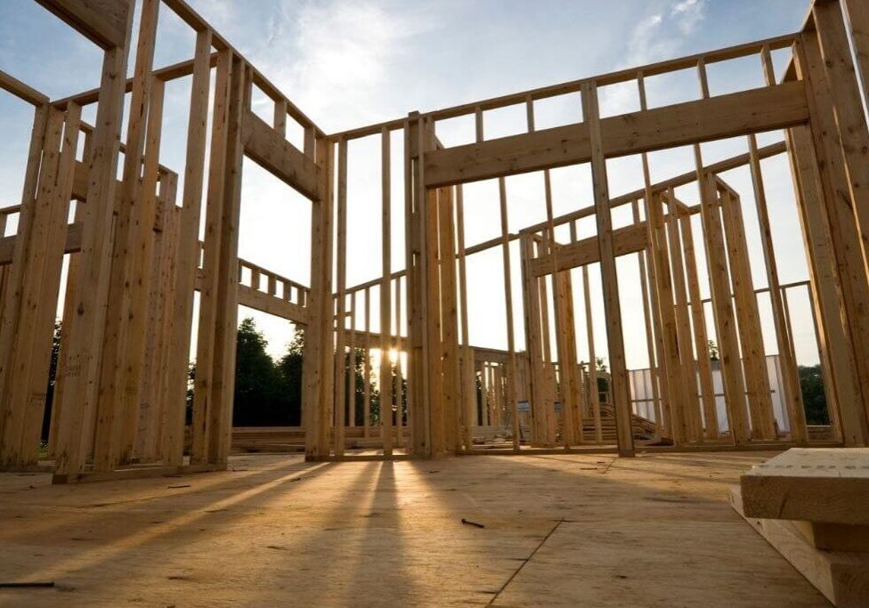 Sunlit building framework at dawn