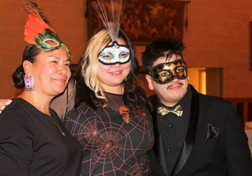 Group wearing decorative masks at party